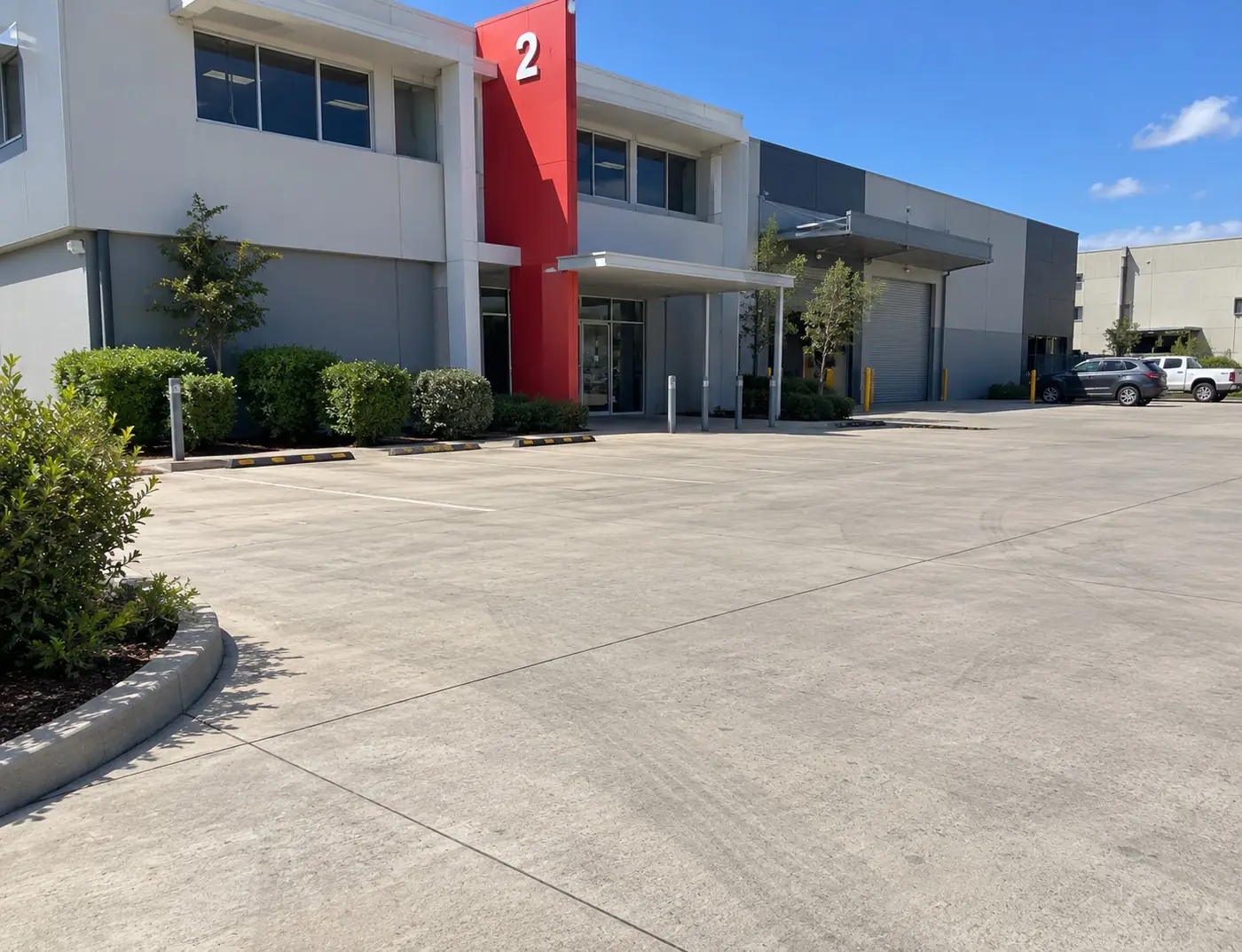 Concrete car park and kerbing at an industrial unit complex