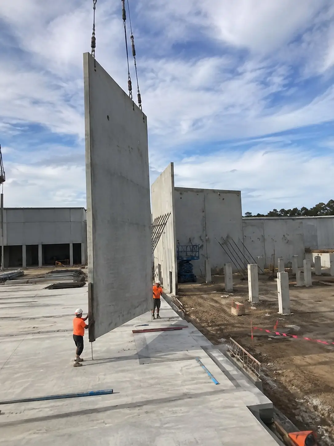 Tilt-up concrete wall panels braced on an industrial slab